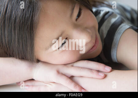 Close up of girl resting on hands