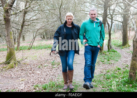 Hiking couple walking in woods