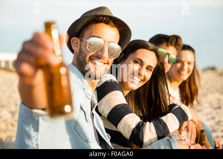 Group of friends at the beach having fun Stock Photo