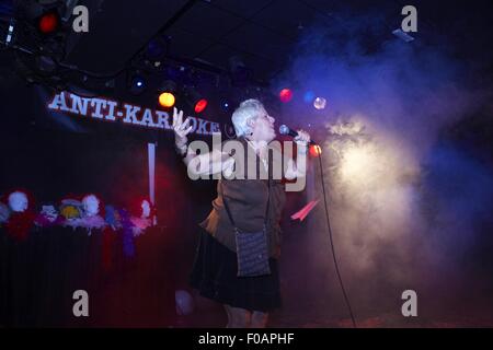 Singer performing in Anti-Karaoke Show at Sala Apolo, Barcelona, Spain Stock Photo