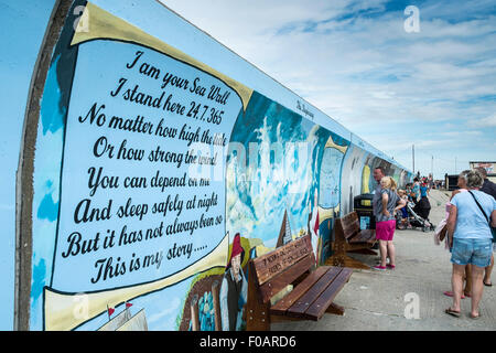 A mural commemorating the Canvey Island flood painted on the sea wall fold defence at Canvey Island, Essex. Stock Photo