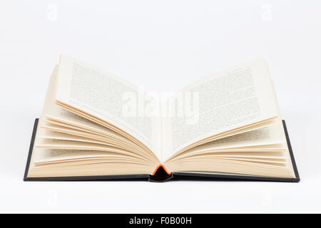 KETTERING, UK - JUNE 30, 2015: Open hardback book isolated on a white background. Reader enthusiasm for print books still strong Stock Photo