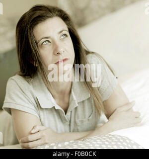 Lonely sad woman deep in thoughts Stock Photo