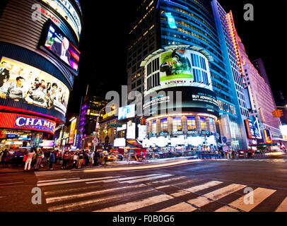 NEW YORK, USA - JUNE 28th 2014: Times Square and 42nd Street is a busy tourist intersection of neon art and commerce and is an i Stock Photo