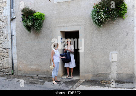 Tourists visiting public toilets at Douelle  a commune in the Lot department in south-western France Midi Pyrenees Stock Photo