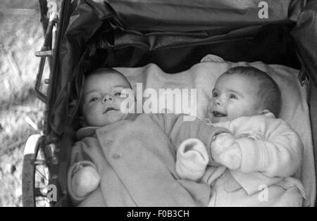 Portrait of two babies in a pram Stock Photo