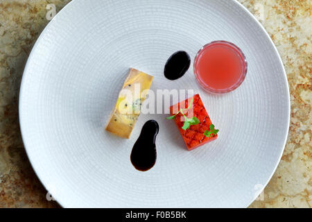 Foie gras, watermelon an juice on a plate Stock Photo