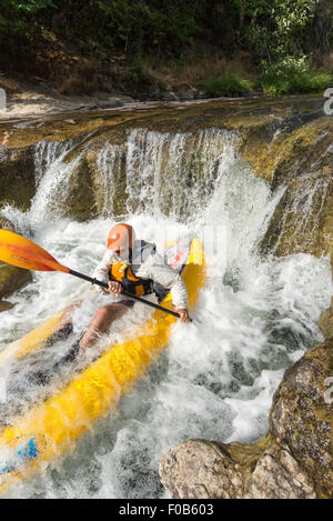 Paddling an inflatable kayak down a waterfall, Fall Creek 