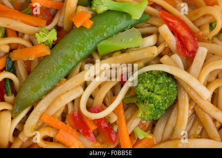 Close view of sesame seasoned noodles with assorted vegetables. Stock Photo