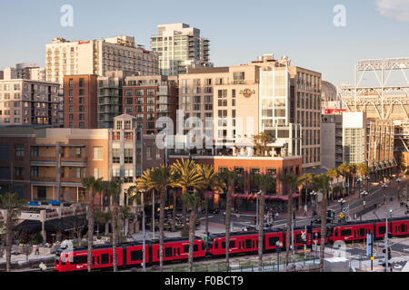 San Diego cityscape from E. Harbor Drive looking over the MTS trolley to the Hard Rock Hotel, Nobo, Lou and Mickey's Steaks, USA Stock Photo