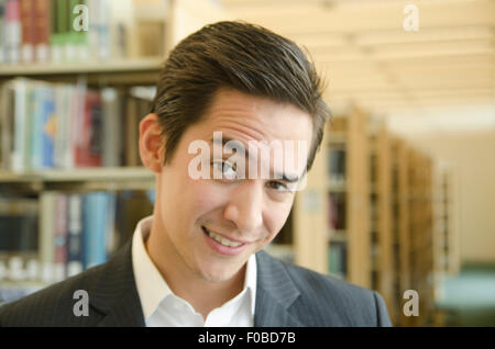 Asian Man in Library wearing suit Stock Photo - Alamy
