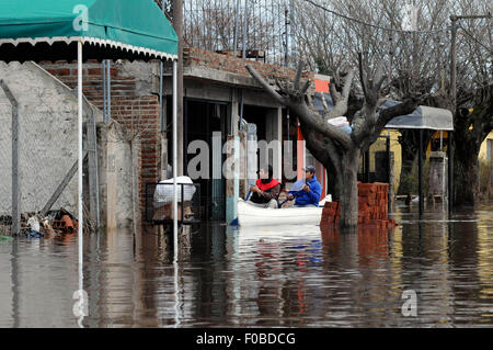 Buenos Aires, Argentina. 11th Aug, 2015. Citizens row a boat in a flooded street in the city of Arrecifes, in Buenos Aires, Argentina, on Aug. 11, 2015. According to the local press, at least 380 people were evacuated due to the flood. Credit:  Jose Granata/TELAM/Xinhua/Alamy Live News Stock Photo