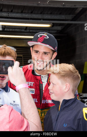 Fans taking pictures on their phones of Racing Driver Daniel Abt  in the pits at the Formula E testing at Donington Raceway UK Stock Photo