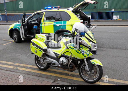 west midlands ambulance service paramedic motorbike and fast response vehicle on a call Birmingham UK Stock Photo