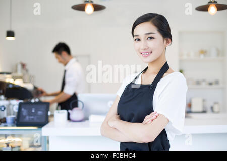 Portrait of coffee shop waitress Stock Photo