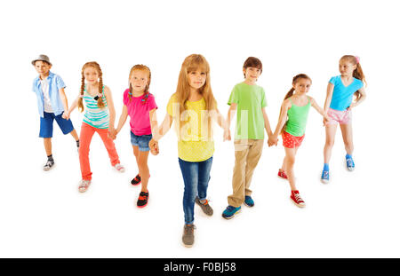 Many boys and girls stand together holding hands Stock Photo