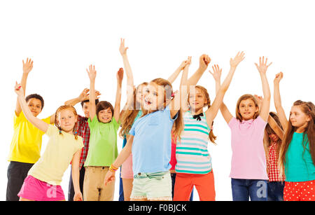 Happy smiling kids rise hands and cheer Stock Photo