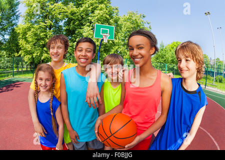 Basketball teenage team standing close after game Stock Photo