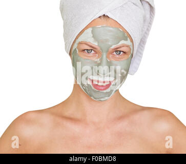 young beauty woman getting facial mask Stock Photo