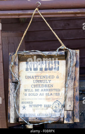 Notice to Unruly Children By Wyatt Earp hanging on a wooden post