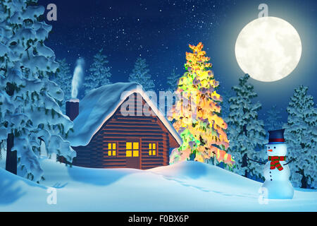 A cabin in a moonlit snowy Christmas landscape at night. The trees are covered in snow and one of the trees is lit by colourful Stock Photo