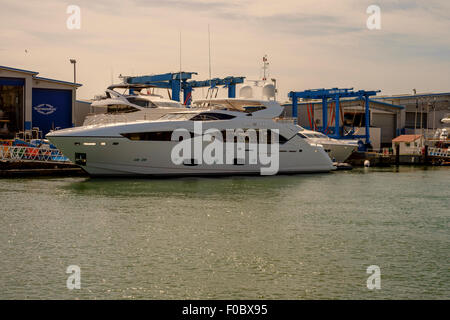 Sunseeker luxury boats alongside in Sunseeker boat yard Poole Dorset United Kingdom Stock Photo