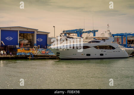 Sunseeker luxury boats alongside in Sunseeker boat yard Poole Dorset United Kingdom Stock Photo