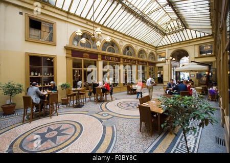Galerie Vivienne is an ancient historical shopping passage with shops, cafe's, and restaurants. I Stock Photo