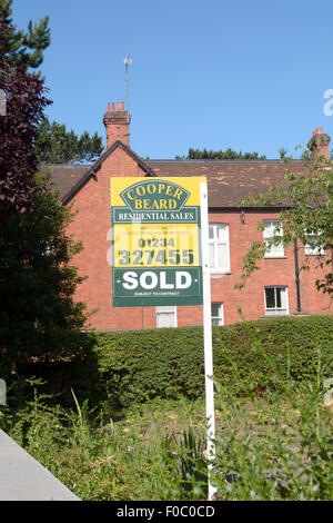 Cooper Beard Estate Agents Sold sign outside property in Bedford, Bedfordshire, England Stock Photo