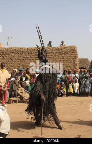 BAMAKO, MALI - OCTOBER 4, 2008:  Religious ceremony of the tribe of bambara. The dancer wears a distinctive hat-traditional wood Stock Photo