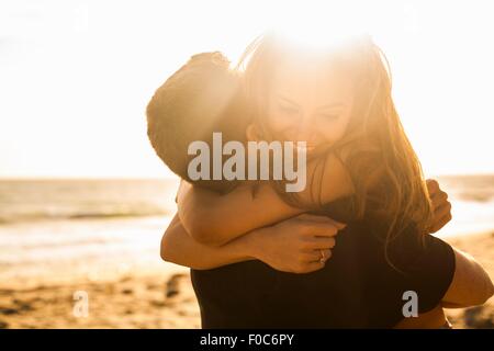 Couple having fun on beach, Malibu, California, USA Stock Photo