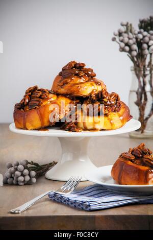 Sticky buns on cake stand Stock Photo