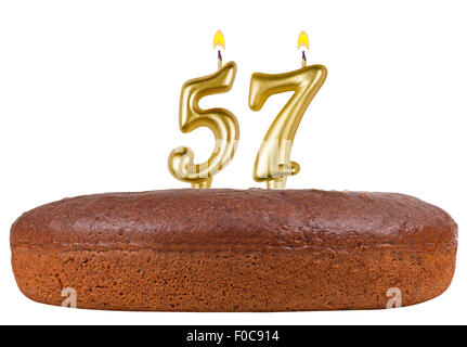 birthday cake with candles number 57 isolated on white background Stock Photo