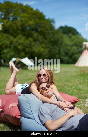 A couple in love in the field on beautiful sky background. Profile