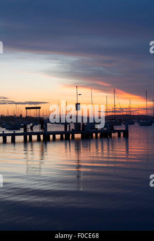Belmont jetty and boats at sunset Lake Macquarie New South Wales NSW Australia Stock Photo