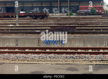 "Amour" ("love") graffito at French railway station, France Stock Photo