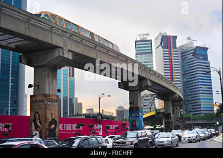 Traffic jam during rush hour and monorail train on elevated rail section in Kuala Lumpu Stock Photo