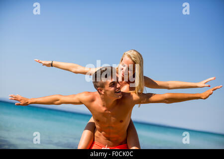 Young couple relaxing on the beach Stock Photo