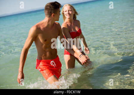 Young couple relaxing on the beach Stock Photo