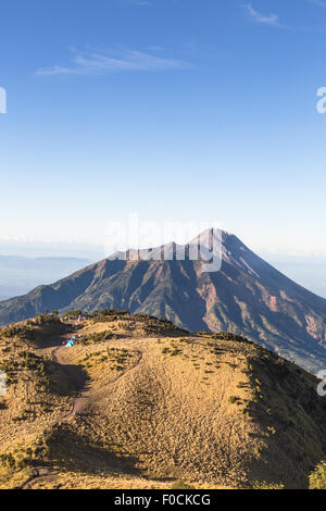 A view of Merapi volcano from the Merbabu volcano near the touristic city of Yogyakarta  in central  Java in Indonesia Stock Photo