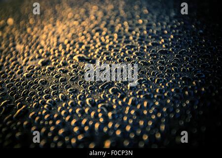 Water Drops on a Car Body After Car Washing. Car Wash Theme. Stock Photo