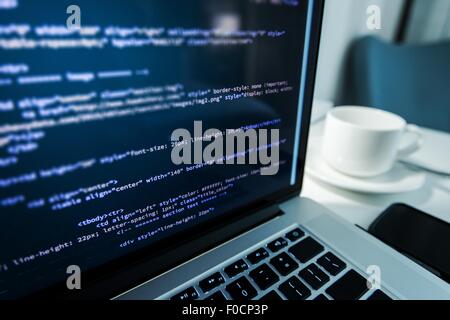 Website Coding. Website HTML Code on the Laptop Display Closeup Photo. Webdesigner Workstation. Stock Photo