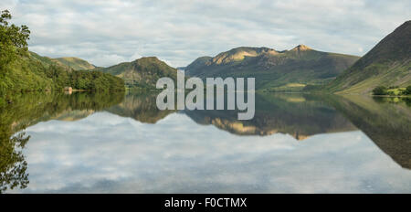 Panoramic view of Crummock Water and surrounding mountains on a calm summer evening in the English Lake District Stock Photo