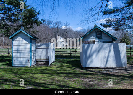 Outhouses at tge one-room schoolhouse at the Landis Valley Farm museum, located in Lancaster County, PA, Stock Photo