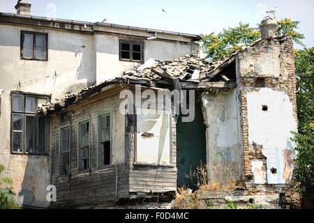 Architecture shot with the facade of a house in ruins Stock Photo