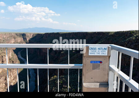 The bridge over the Rio Grande Gorge Bridge near Taos New Mexico is equipped with suicide crisis hot line phone. Stock Photo