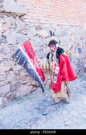 Native American with traditional costume participates at the festival of Valle del Maiz Stock Photo