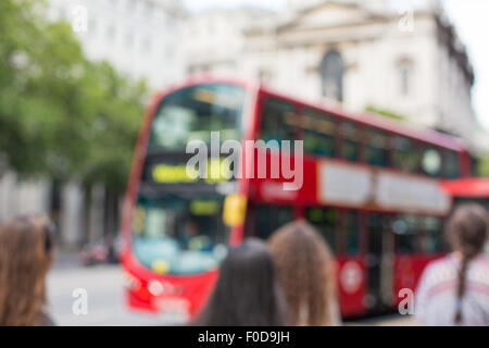 city street with red double decker bus in london Stock Photo