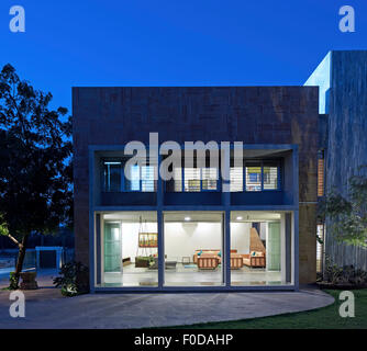 Dusk elevation towards living area. Marbled House, Ahmedabad, India. Architect: Matharoo Associates, 2015. Stock Photo