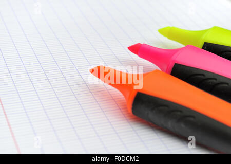 closeup on three highlighters without pen cap on white paper Stock Photo
